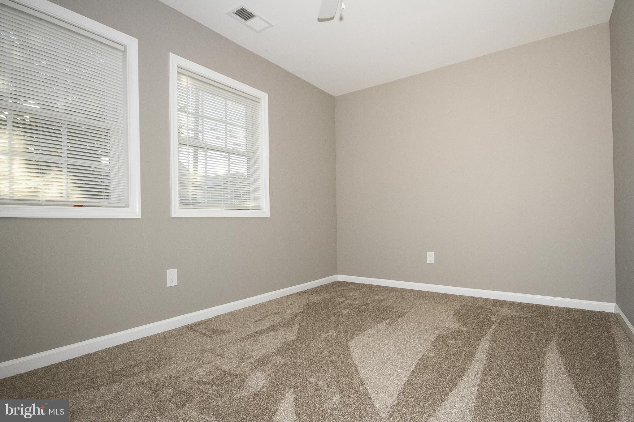 700 Middle River Road Baltimore, MD 21220 - Photo 10 of 29 a view of an empty room with a window