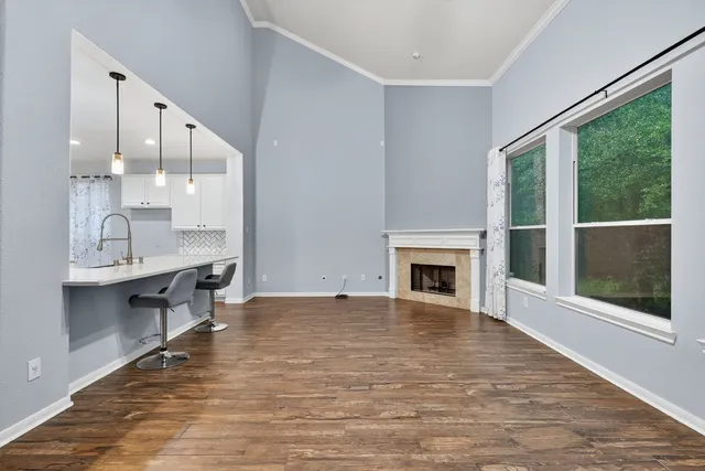 a view of a kitchen with a sink and a fireplace