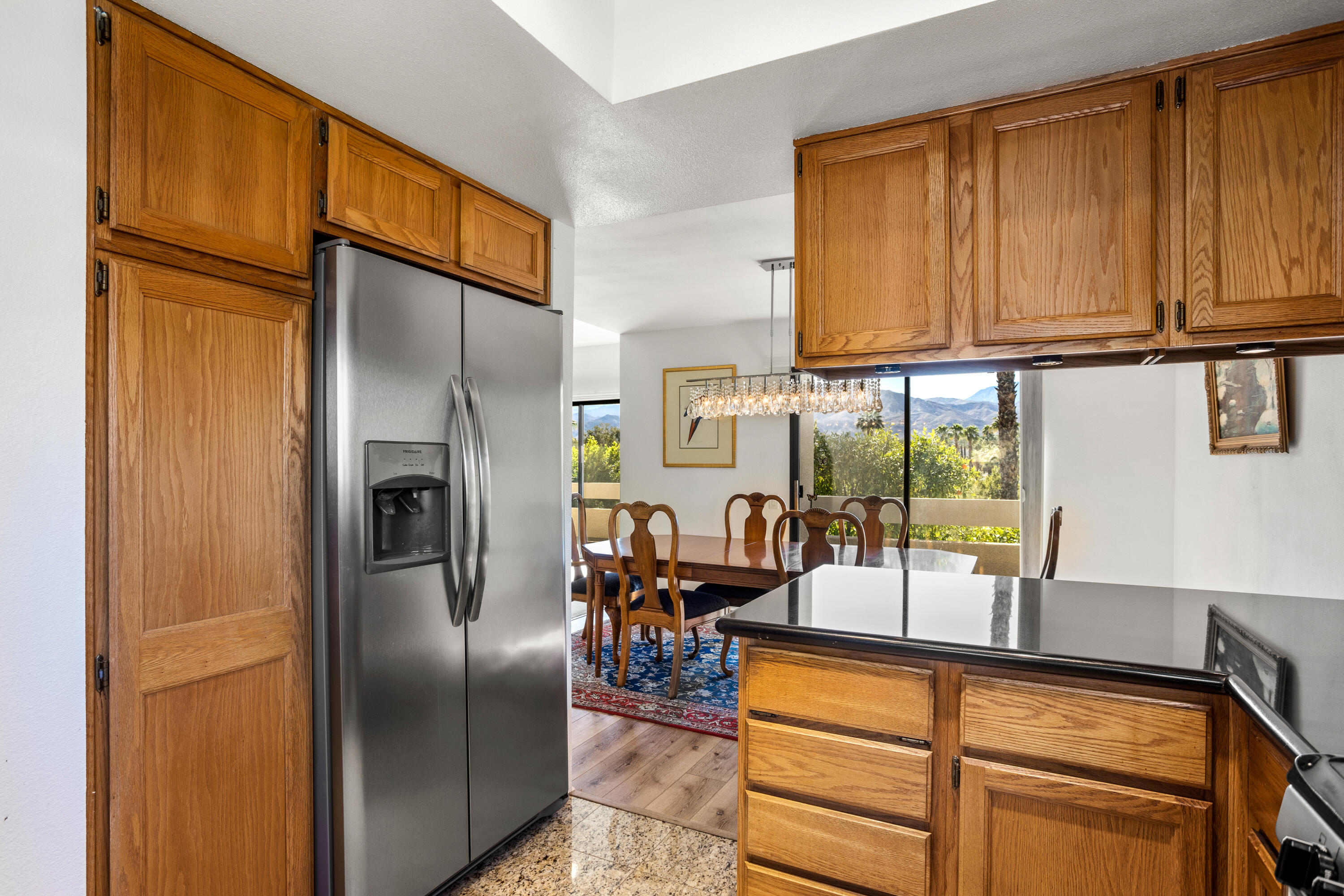 11 Mission Court Rancho Mirage, CA 92270 - Photo 11 of 59 a kitchen with stainless steel appliances granite countertop a refrigerator and cabinets