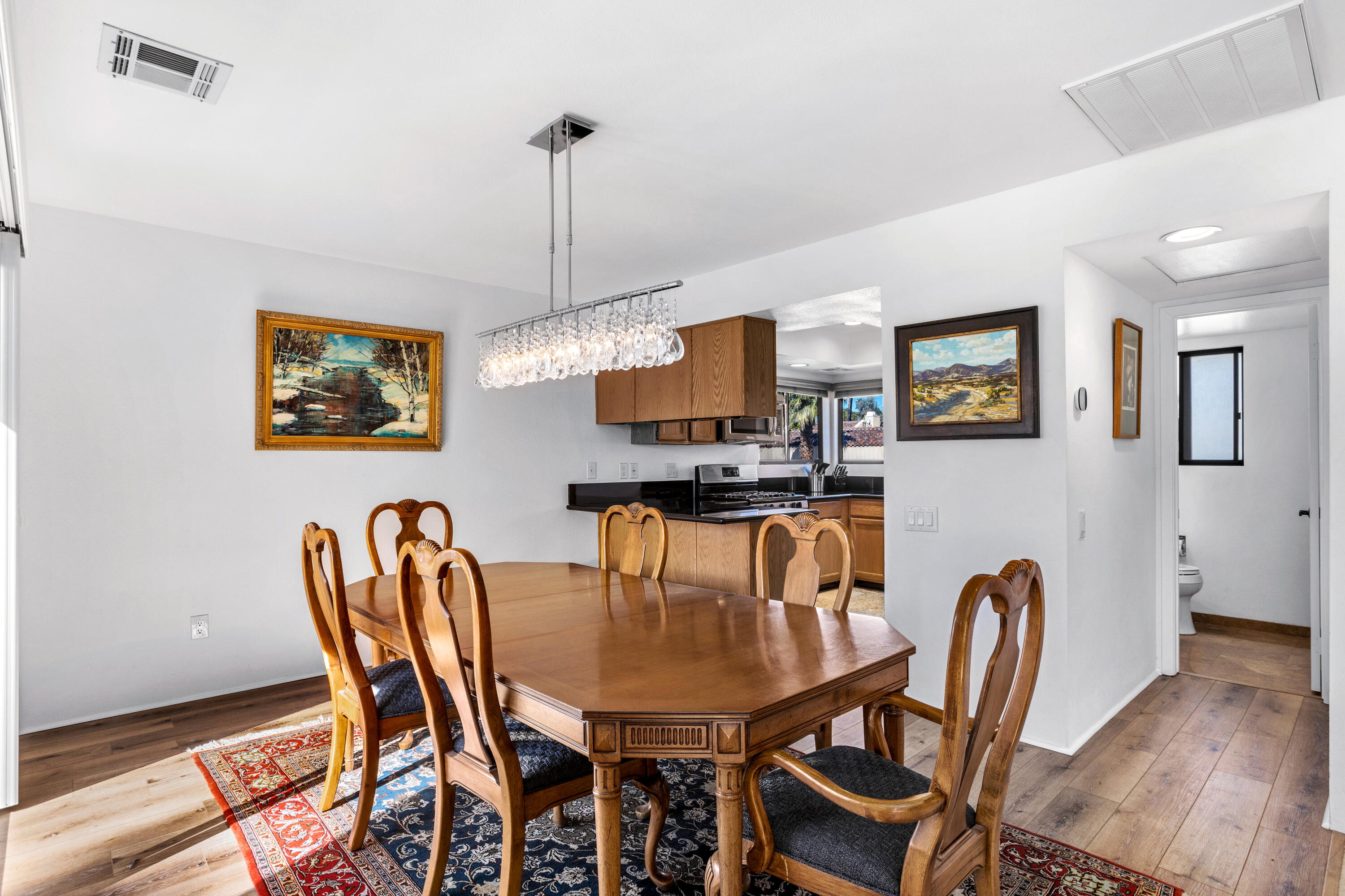 11 Mission Court Rancho Mirage, CA 92270 - Photo 14 of 59 a view of a dining room with furniture