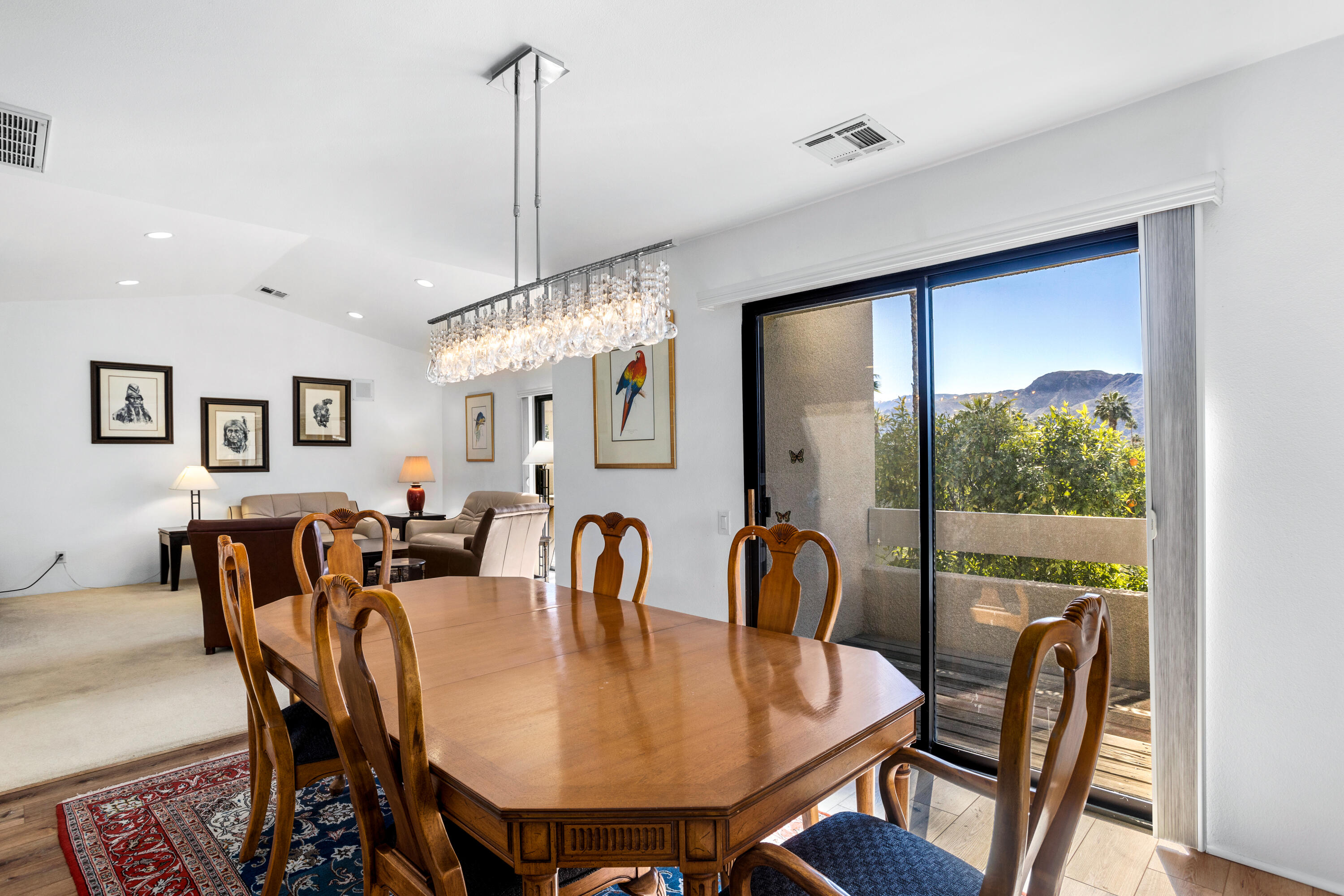 11 Mission Court Rancho Mirage, CA 92270 - Photo 15 of 59 a view of a dining room with furniture window and wooden floor
