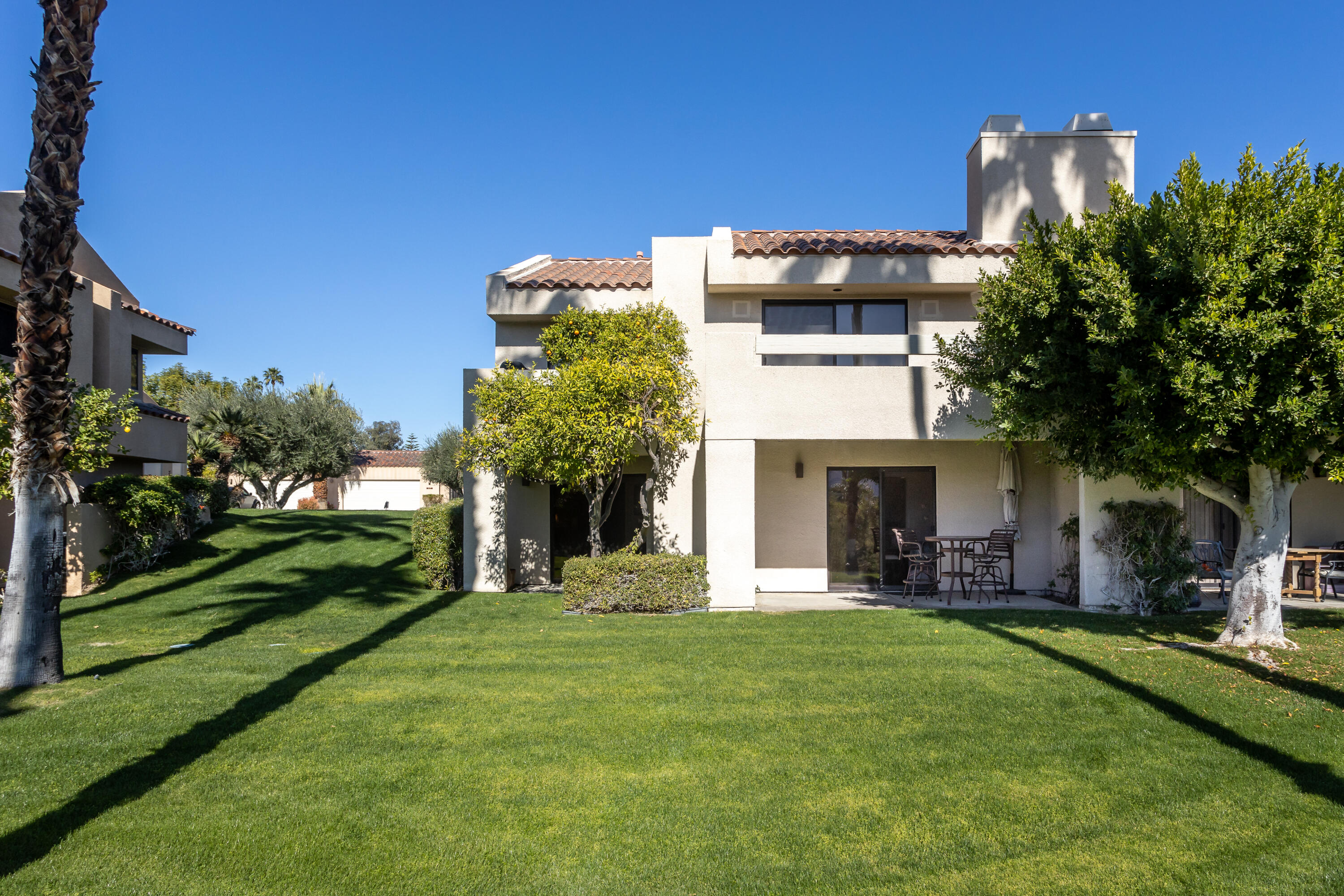 11 Mission Court Rancho Mirage, CA 92270 - Photo 17 of 59 a view of a house with a yard and potted plants