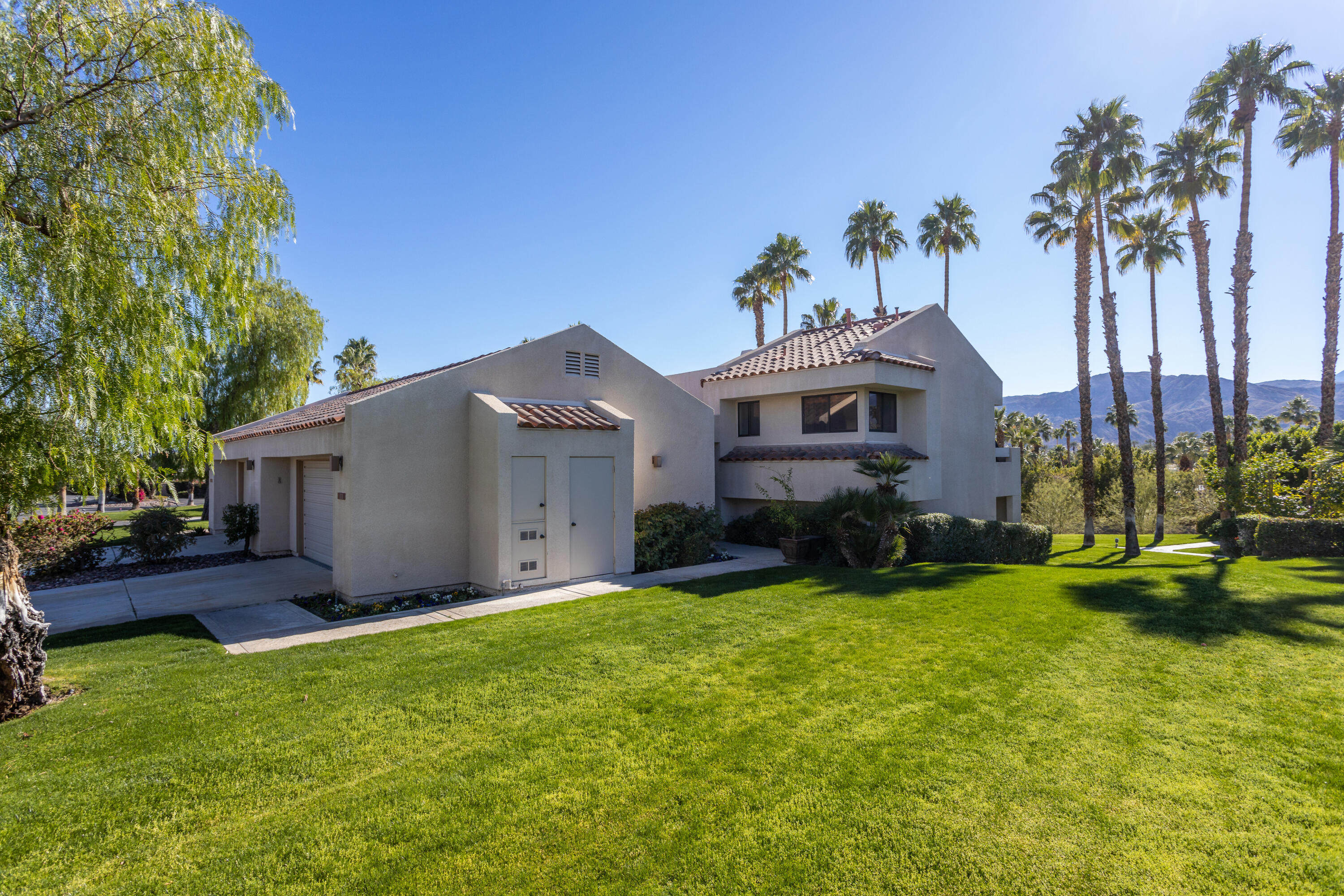 11 Mission Court Rancho Mirage, CA 92270 - Photo 18 of 59 a front view of a house with garden