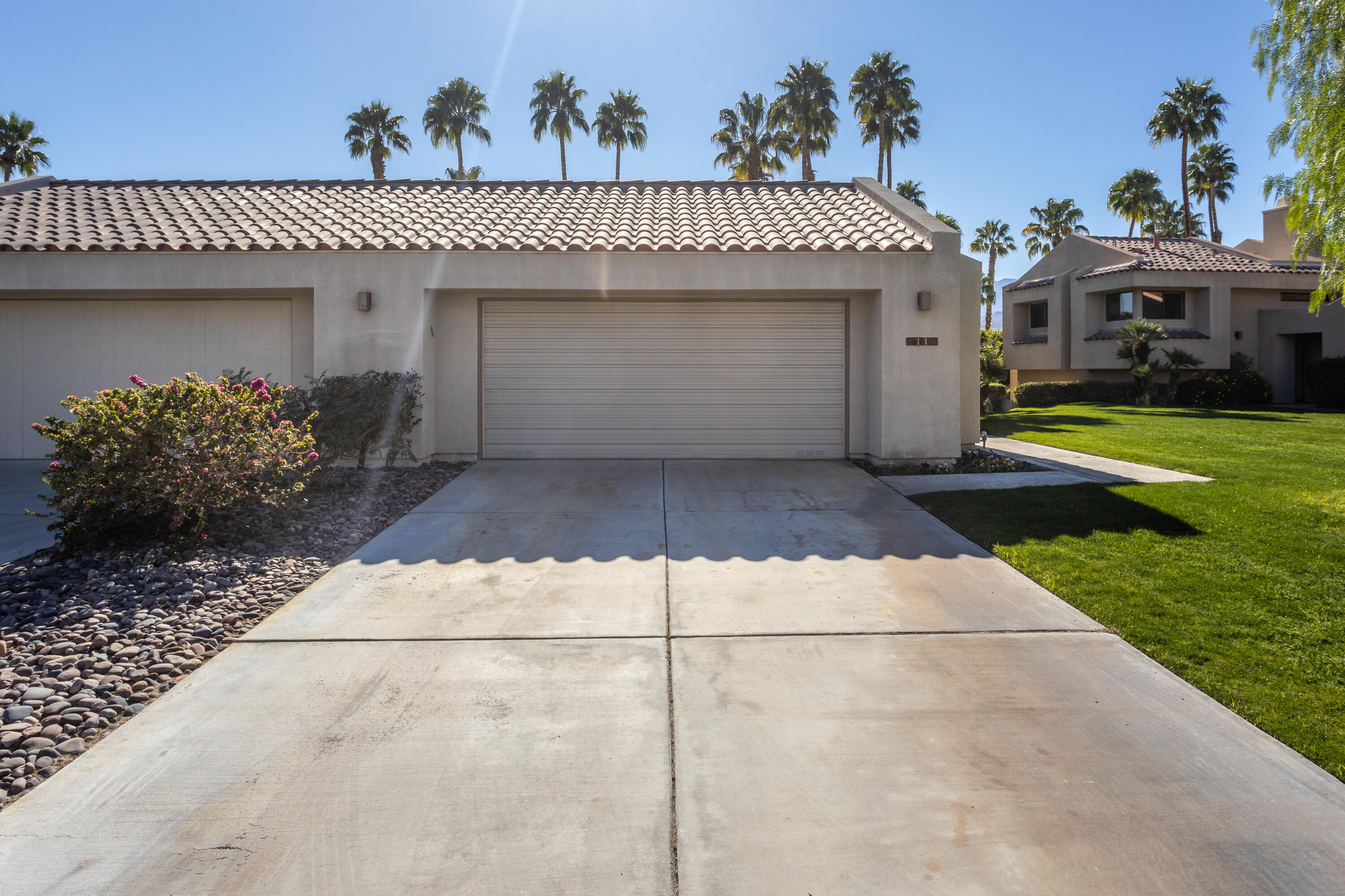 11 Mission Court Rancho Mirage, CA 92270 - Photo 19 of 59 a front view of a house with garden