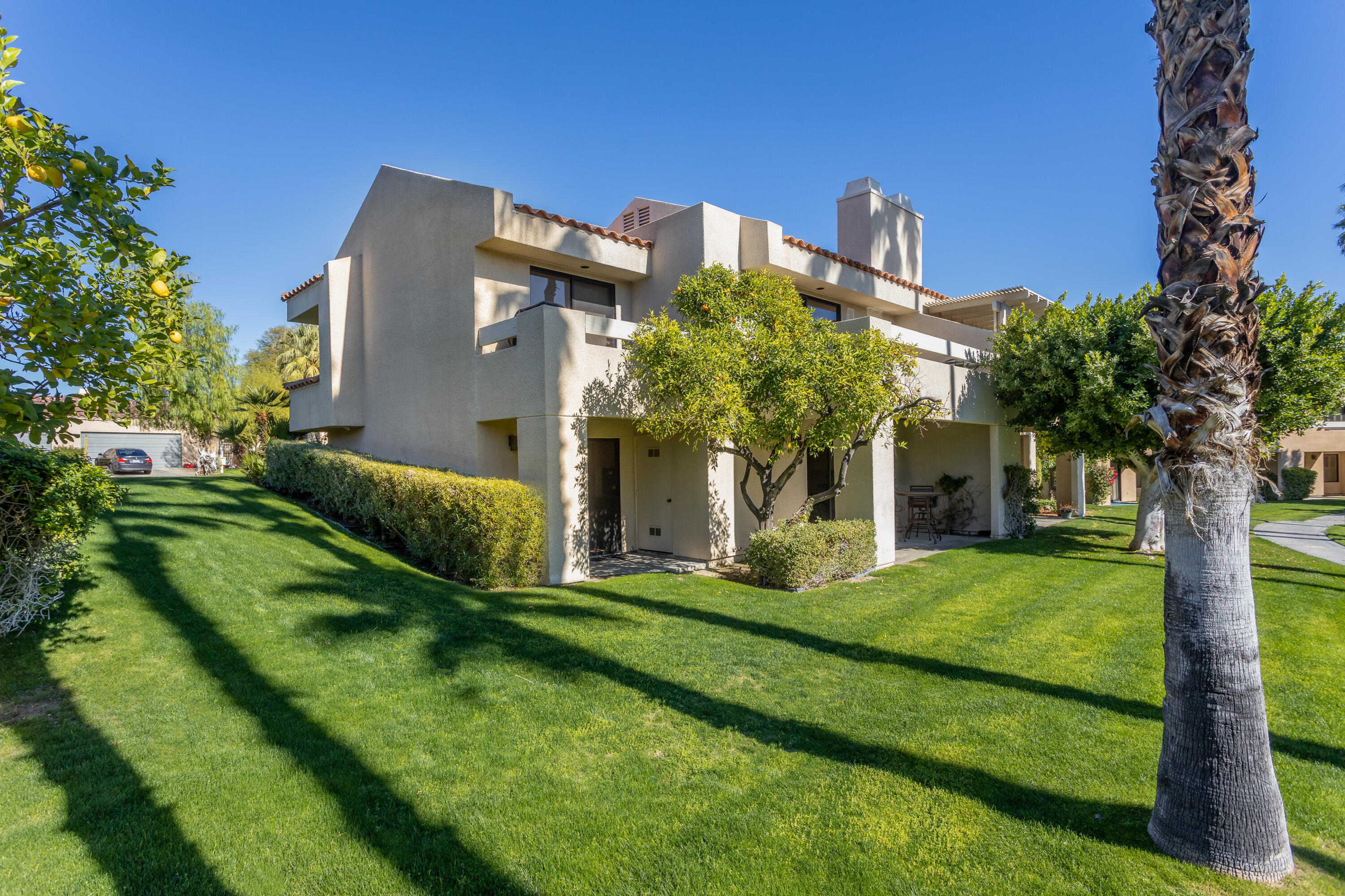 11 Mission Court Rancho Mirage, CA 92270 - Photo 2 of 59 a front view of a house with a garden