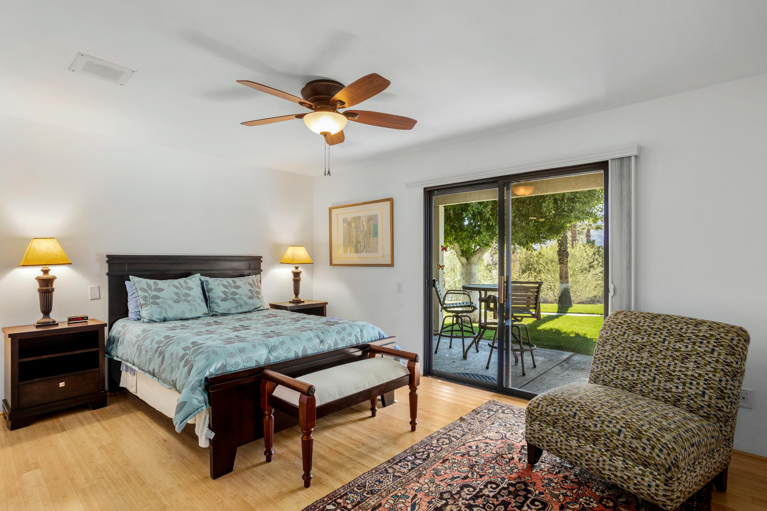 11 Mission Court Rancho Mirage, CA 92270 - Photo 25 of 59 a bedroom with a bed and a couch