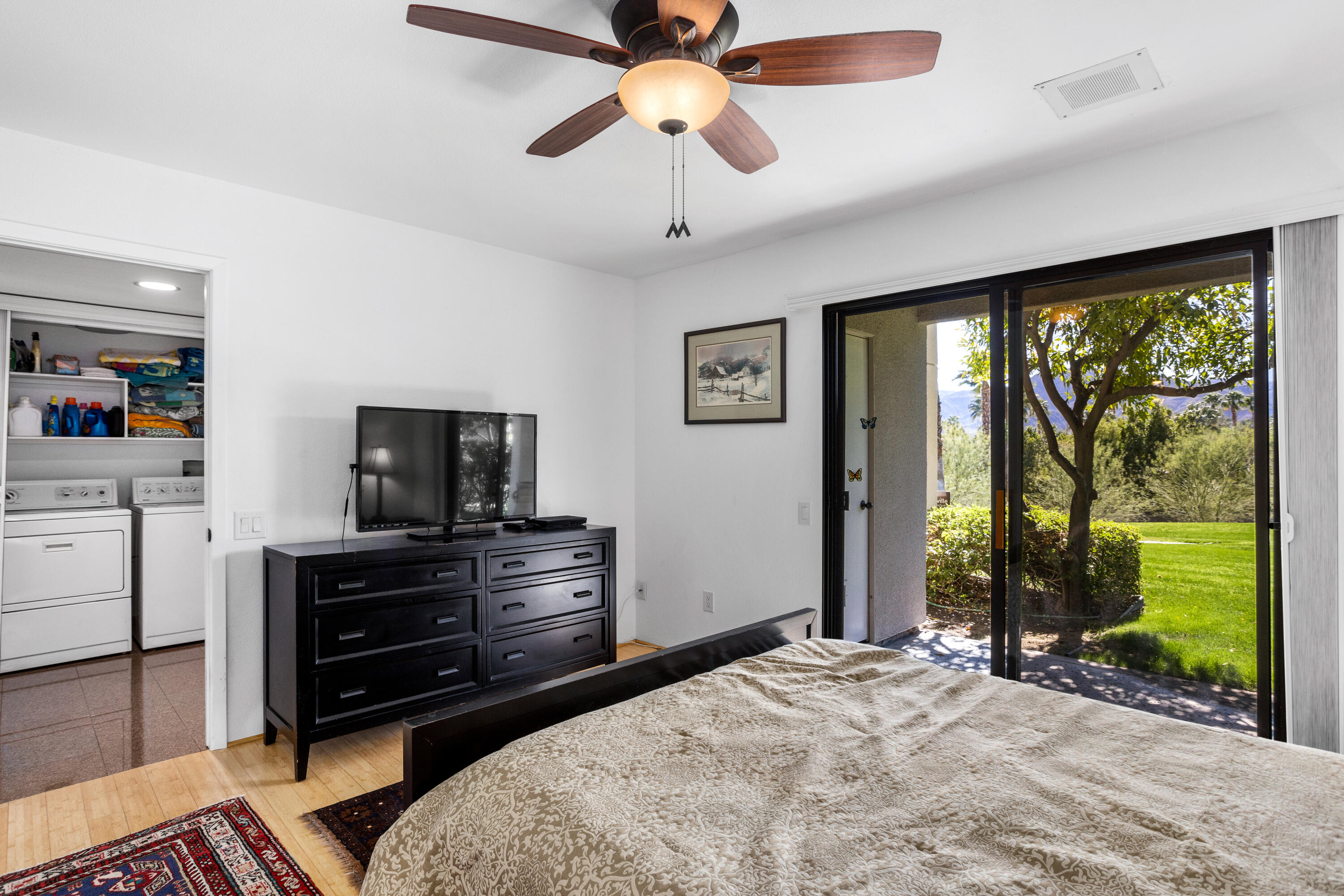 11 Mission Court Rancho Mirage, CA 92270 - Photo 34 of 59 a bedroom with a bed and a television
