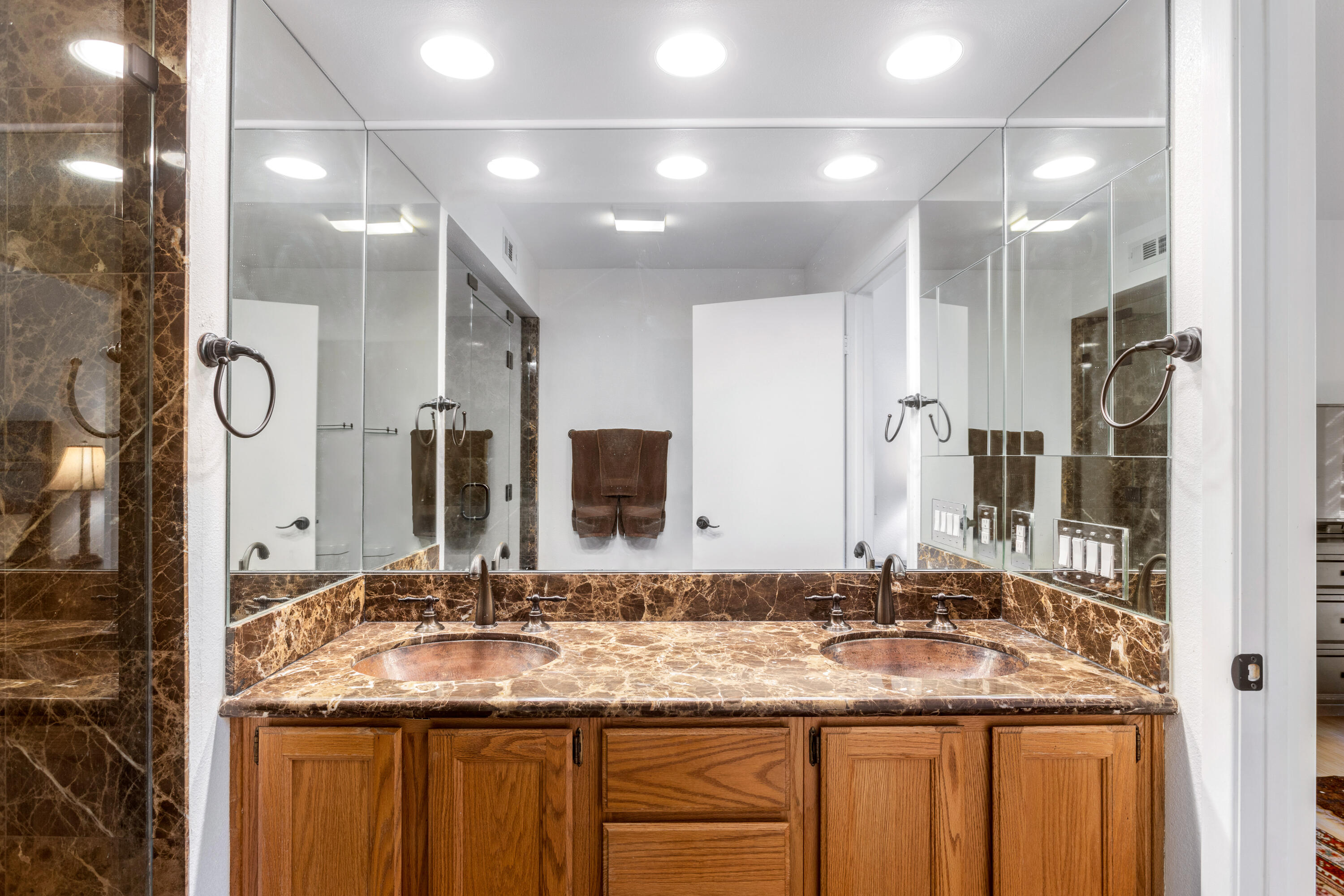 11 Mission Court Rancho Mirage, CA 92270 - Photo 37 of 59 a bathroom with a granite countertop sink and a mirror