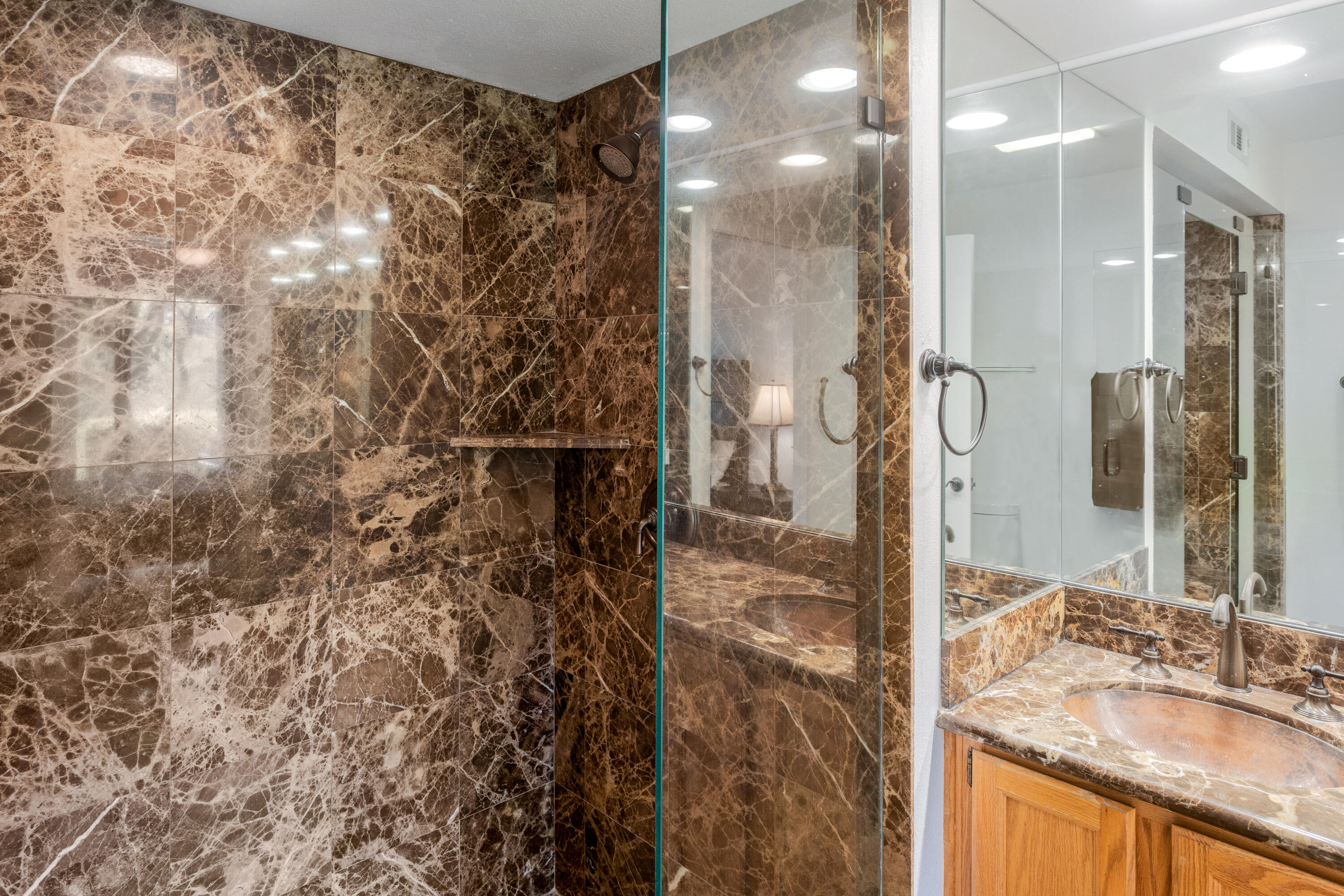 11 Mission Court Rancho Mirage, CA 92270 - Photo 38 of 59 a bathroom with a granite countertop shower a sink and a mirror