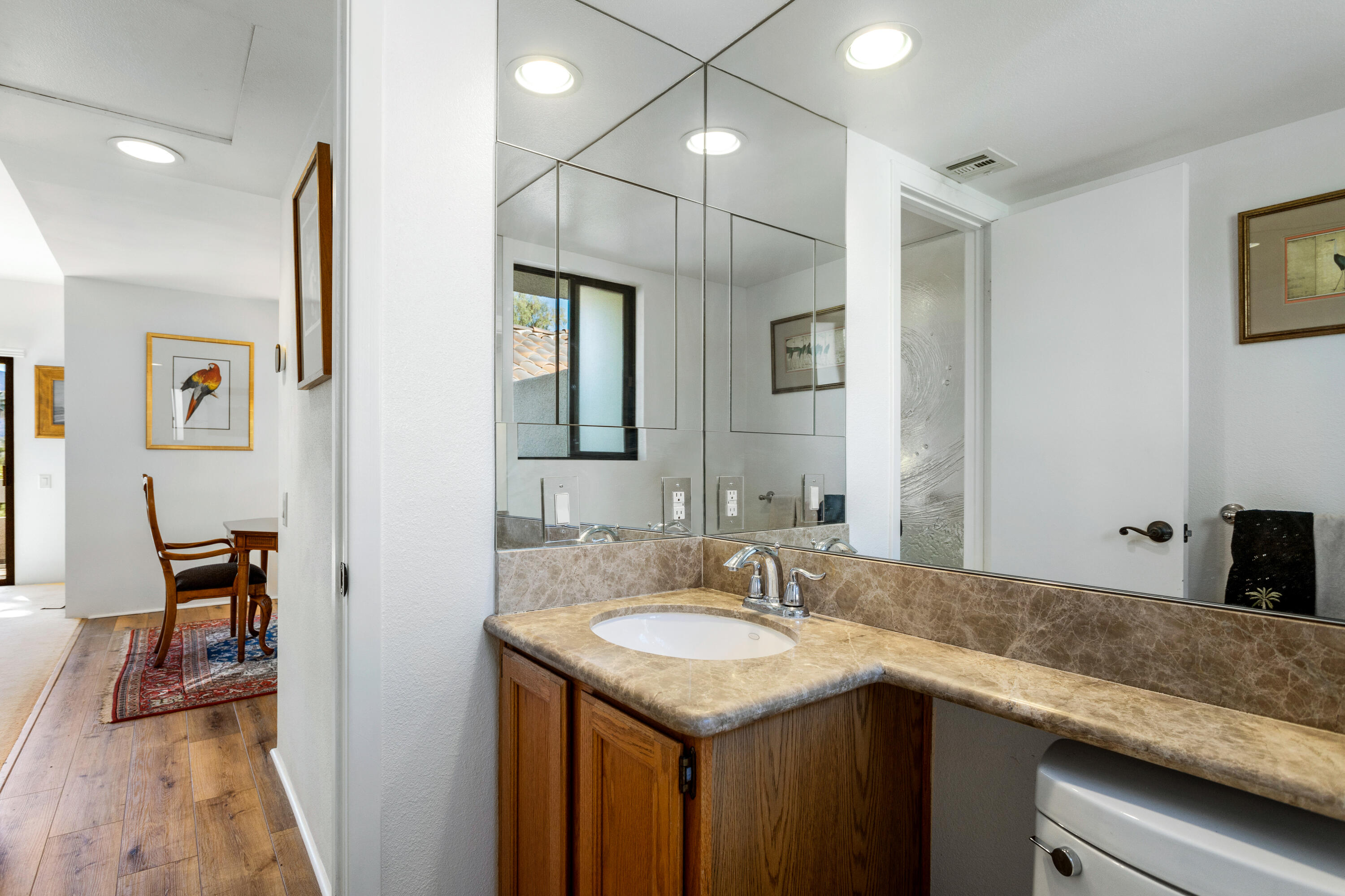 11 Mission Court Rancho Mirage, CA 92270 - Photo 45 of 59 a bathroom with a sink a vanity and a mirror