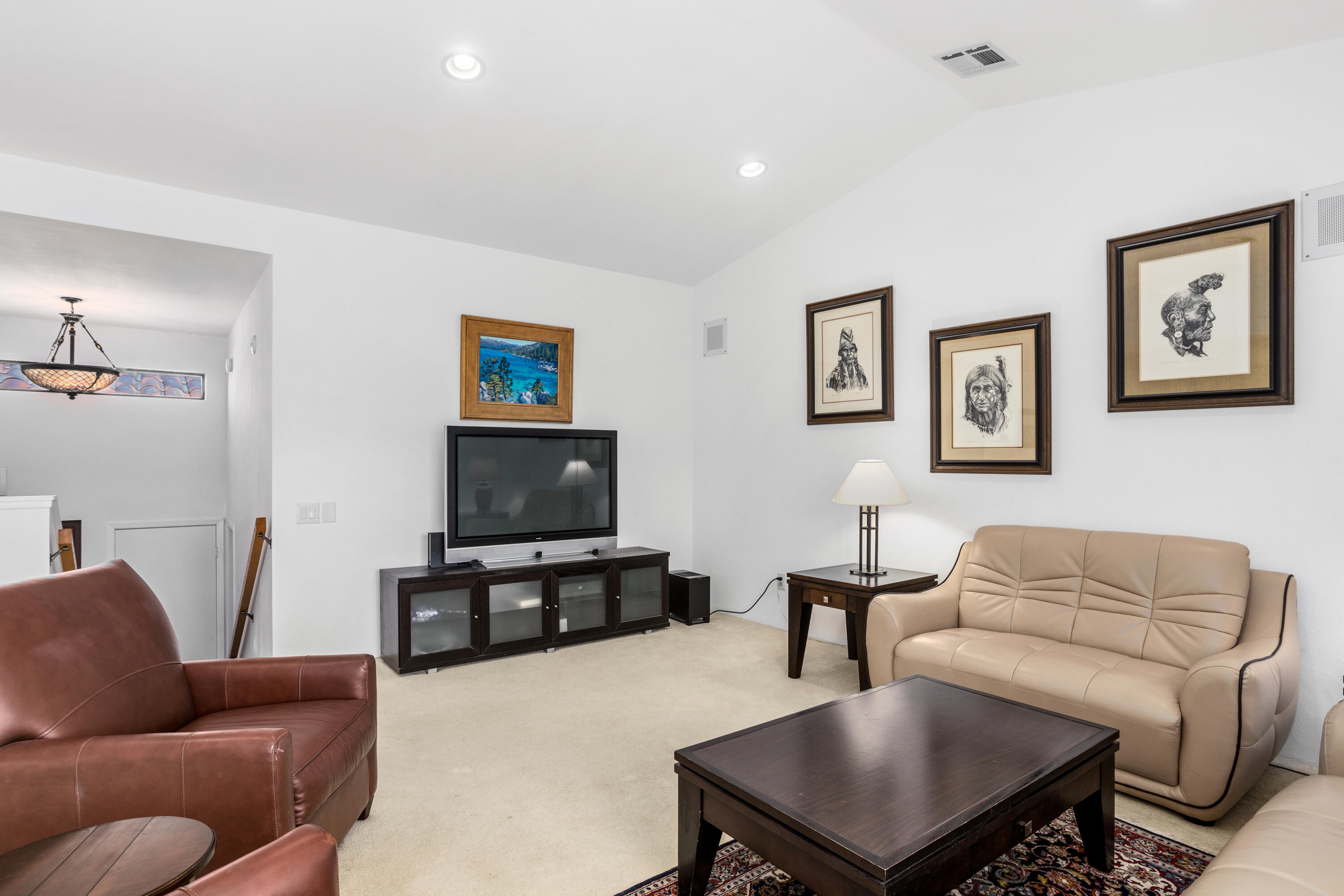 11 Mission Court Rancho Mirage, CA 92270 - Photo 5 of 59 a living room with furniture and a flat screen tv