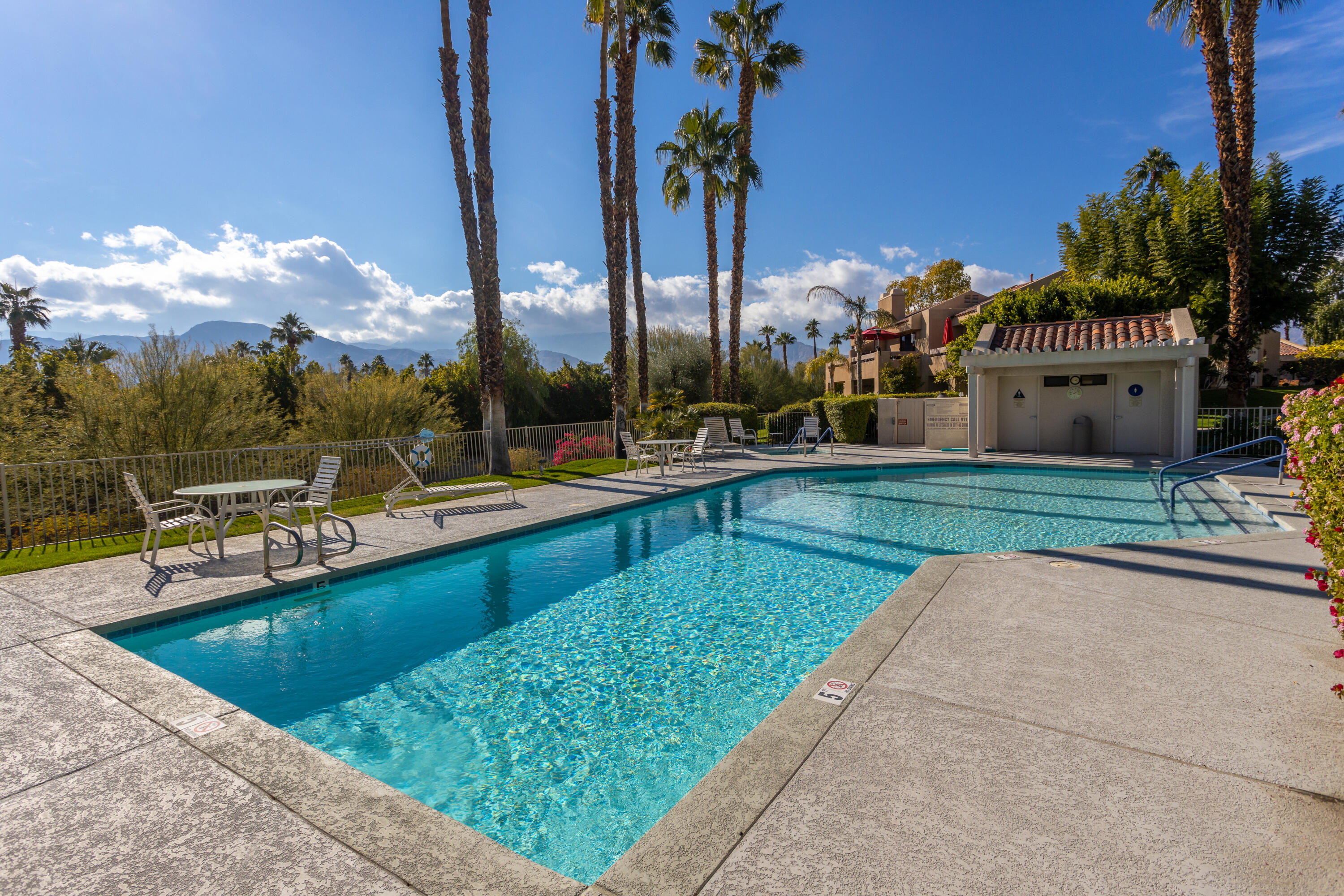 11 Mission Court Rancho Mirage, CA 92270 - Photo 53 of 59 a view of a swimming pool and lounge chairs