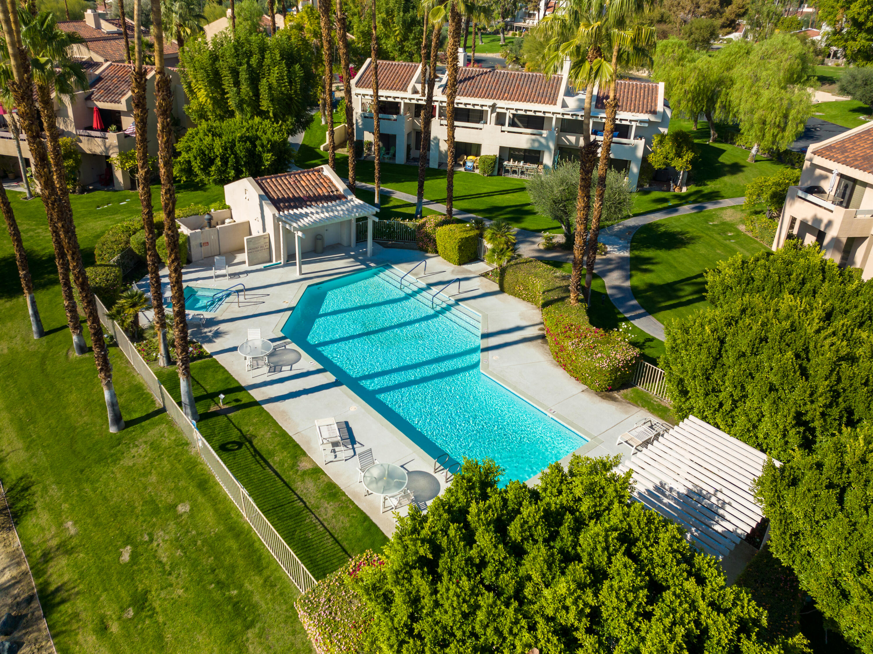 11 Mission Court Rancho Mirage, CA 92270 - Photo 54 of 59 an aerial view of a house with a garden and trees