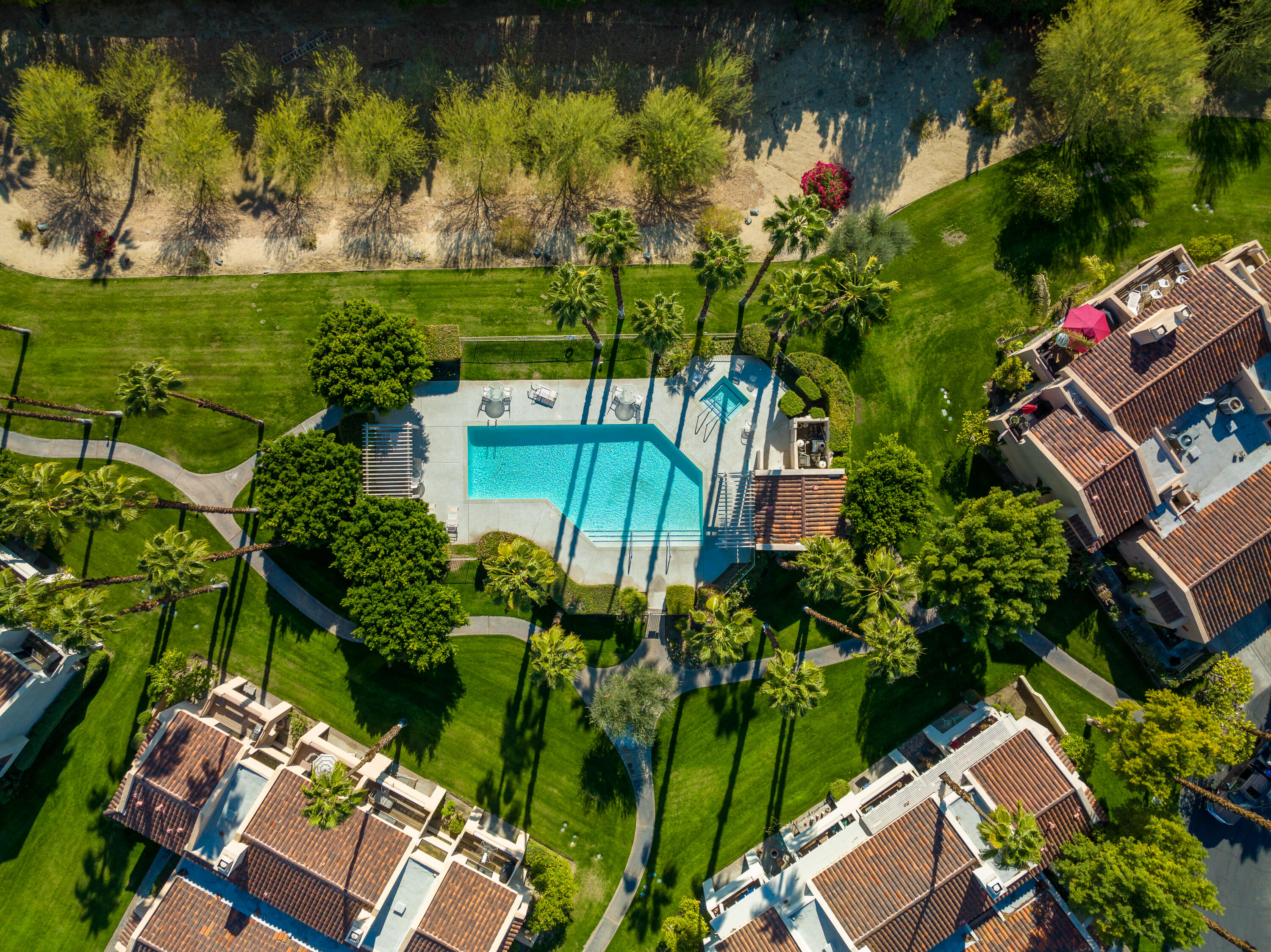 11 Mission Court Rancho Mirage, CA 92270 - Photo 56 of 59 an aerial view of a house with a yard lake outdoor seating and yard