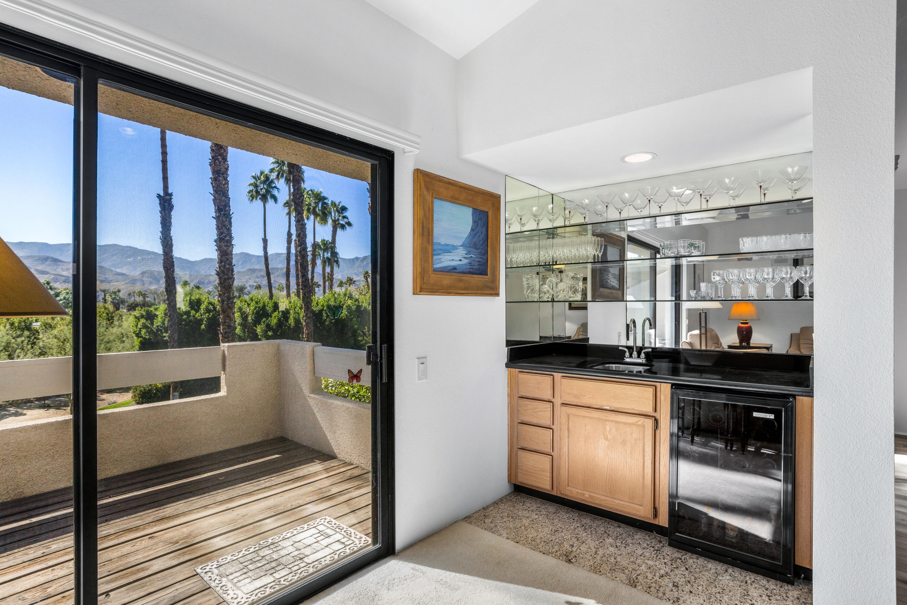 11 Mission Court Rancho Mirage, CA 92270 - Photo 6 of 59 a kitchen with stainless steel appliances a counter top space and a large window