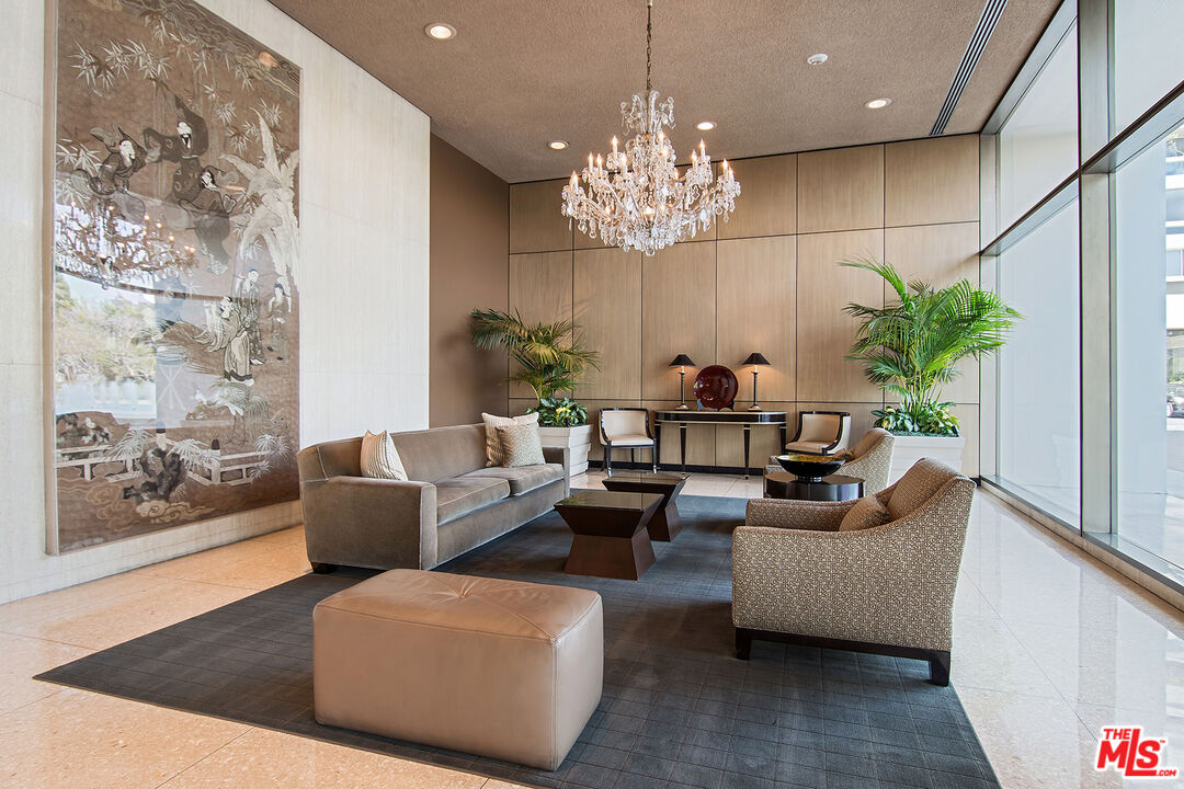 2220 Avenue Of The Stars, Unit 702 Los Angeles, CA 90067 - Photo 16 of 21 a living room with patio furniture and a chandelier