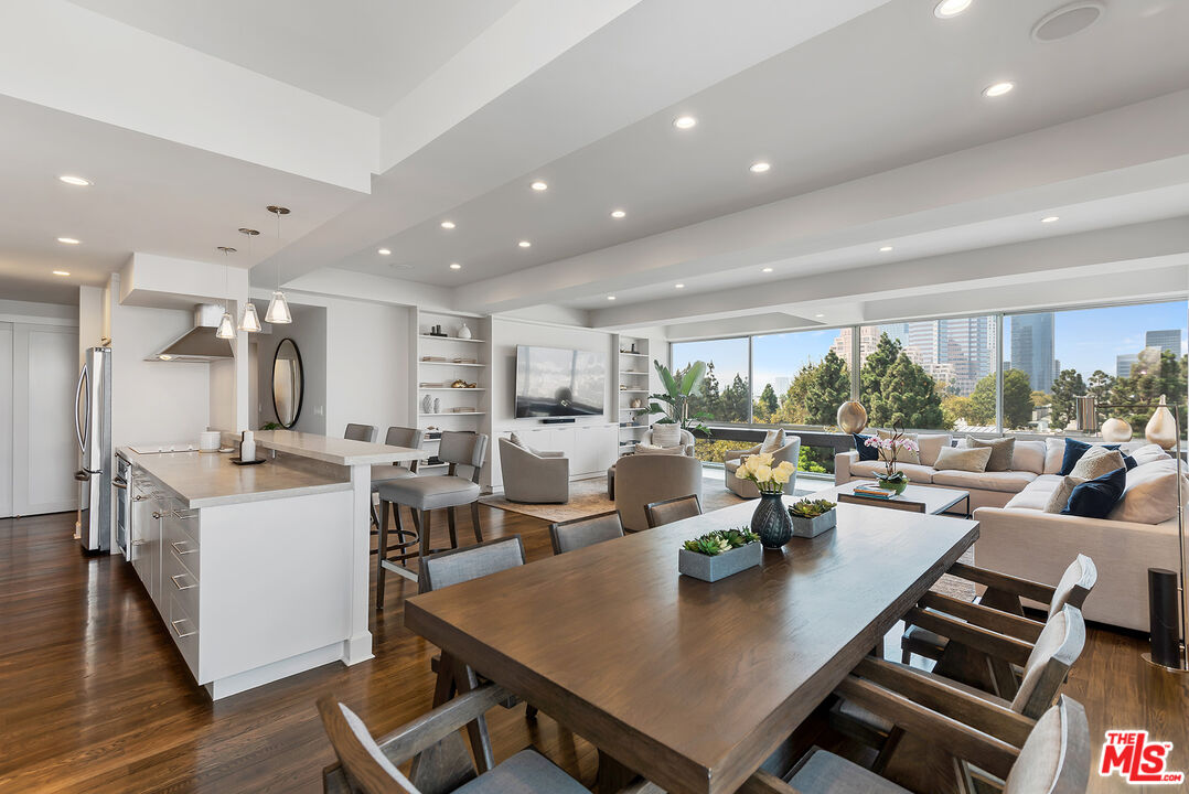 2220 Avenue Of The Stars, Unit 702 Los Angeles, CA 90067 - Photo 8 of 21 a living room with lots of furniture and a view of kitchen