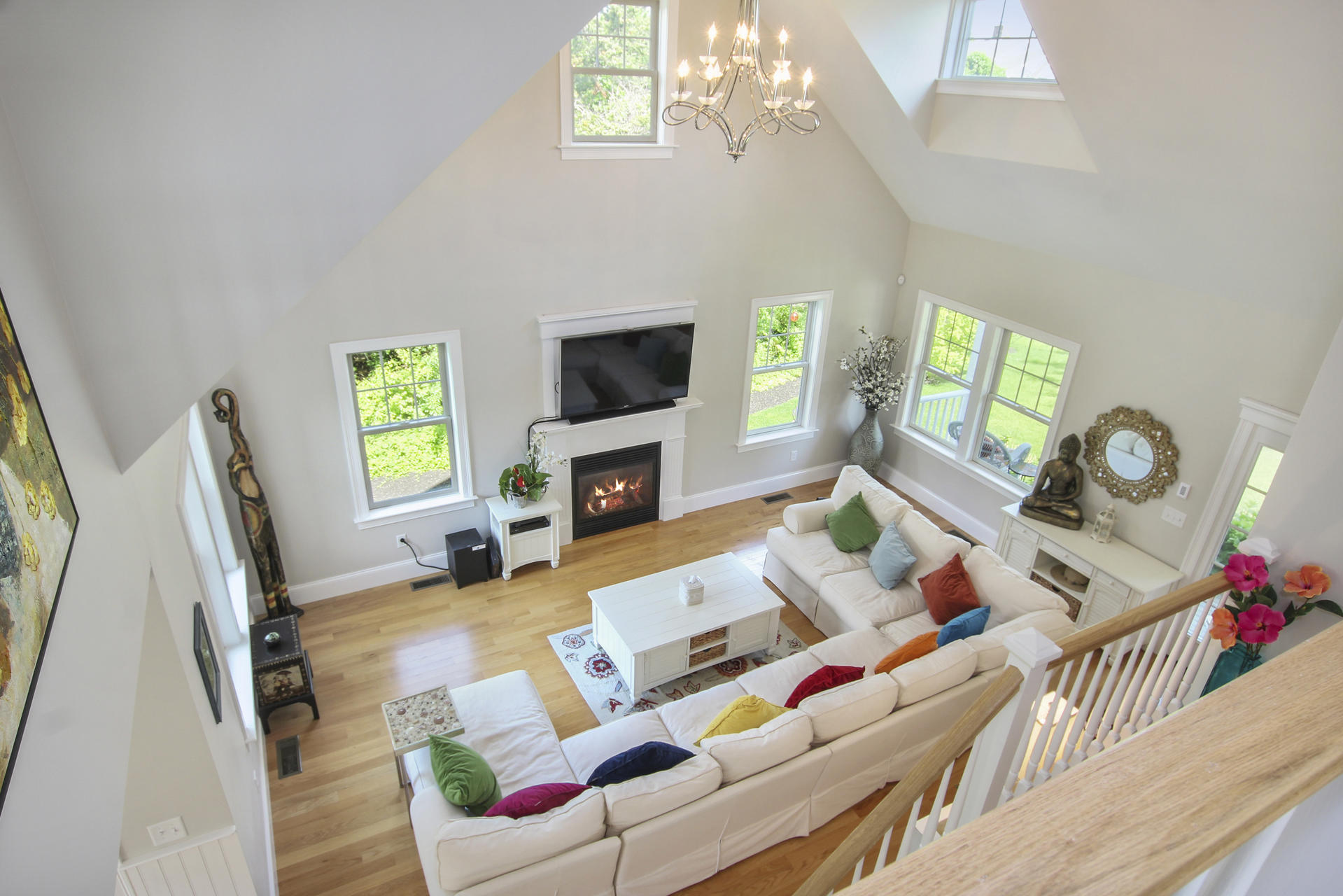 47 Briar Spring Road Orleans, MA 02653 - Photo 18 of 30 a living room with furniture a fireplace and a flat screen tv