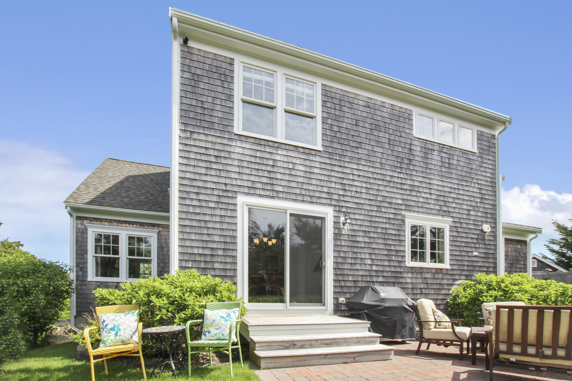 47 Briar Spring Road Orleans, MA 02653 - Photo 20 of 30 a front view of a house with a garden