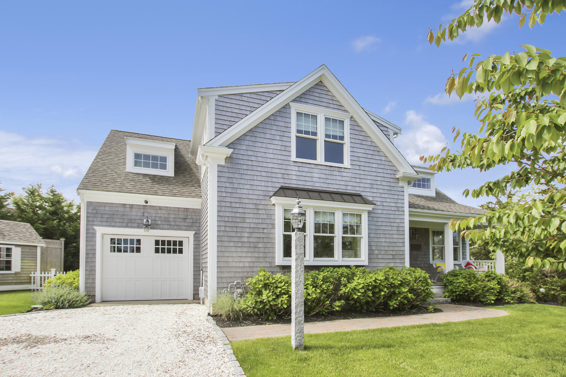 47 Briar Spring Road Orleans, MA 02653 - Photo 3 of 30 a front view of a house with a yard