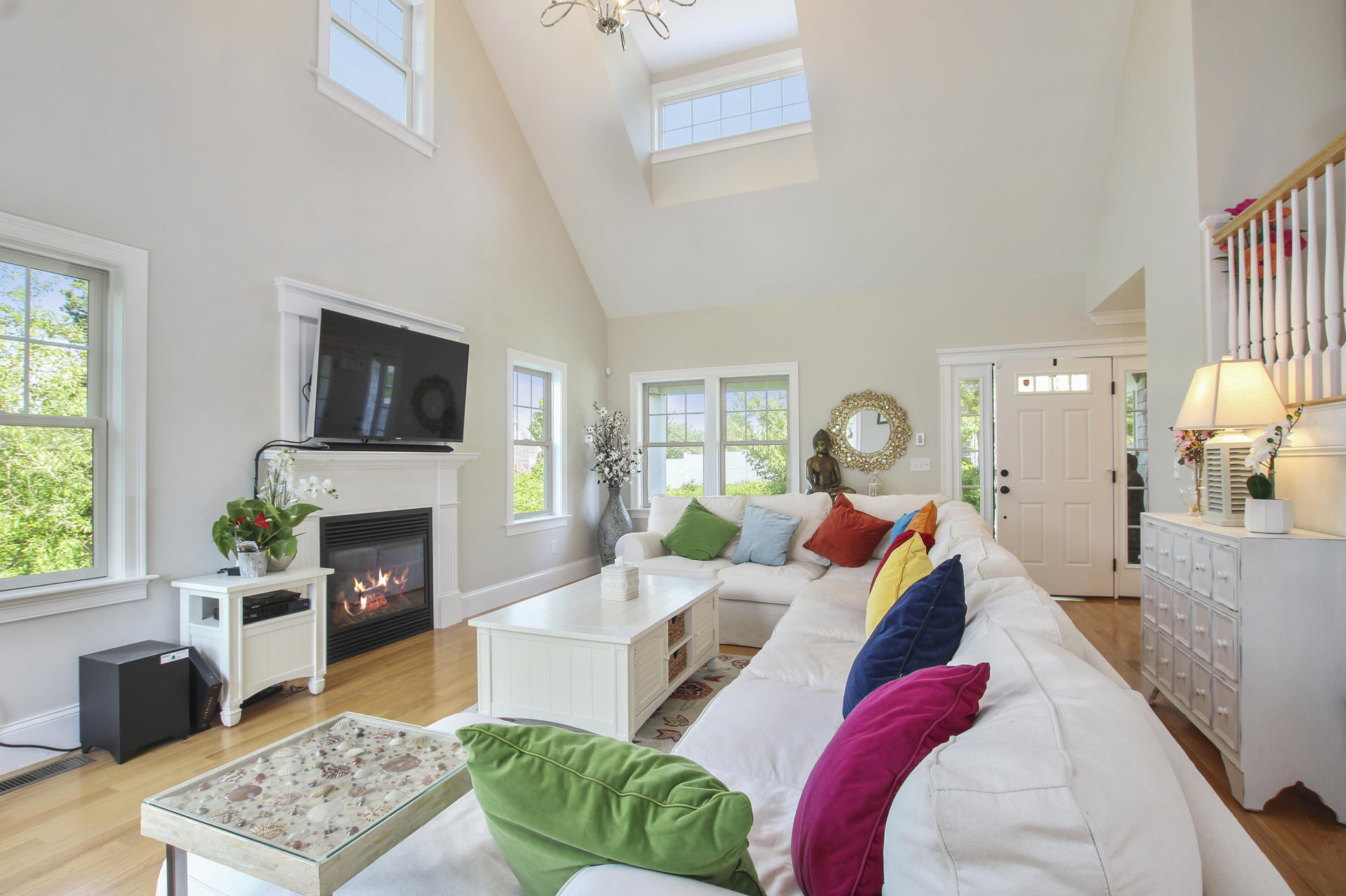 47 Briar Spring Road Orleans, MA 02653 - Photo 5 of 30 a living room with fireplace furniture and a flat screen tv