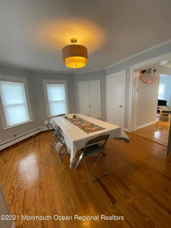 a view of a room with a wooden floor