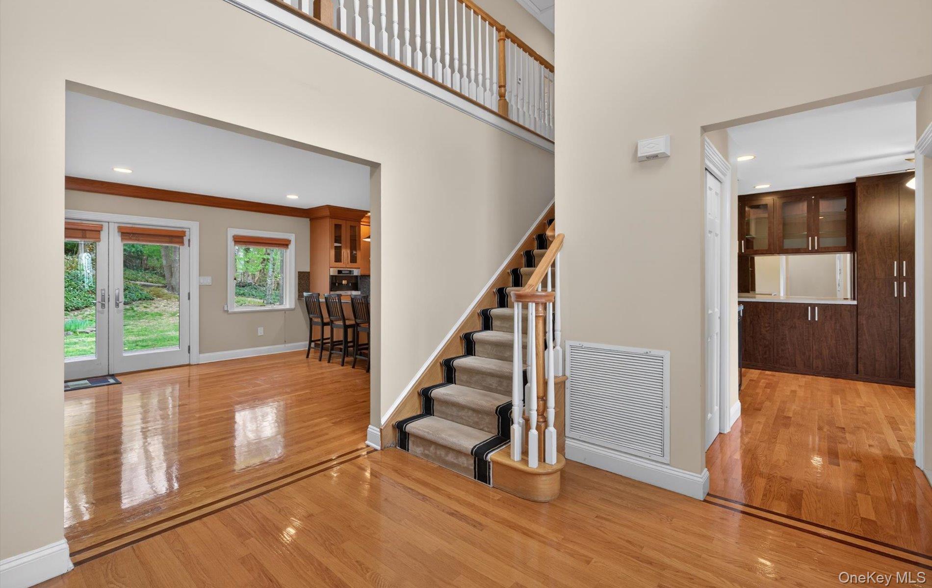 16 East Slope Road Bayville, NY 11709 - Photo 9 of 48 Hardwood flooring with border inlay throughout the entryway.
