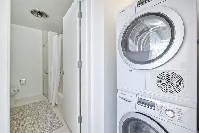 a view of a hallway with washer and dryer