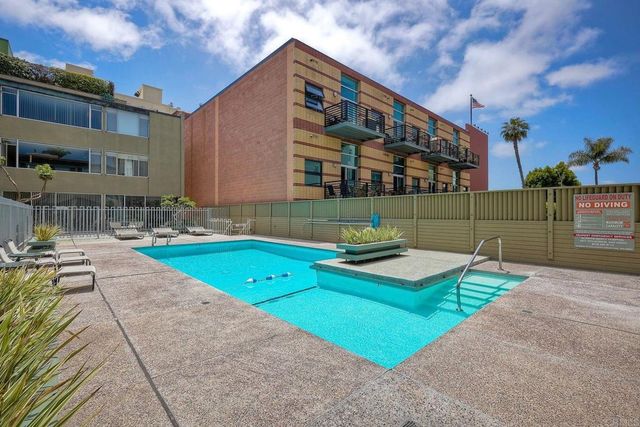 a view of a chair and tables in the patio