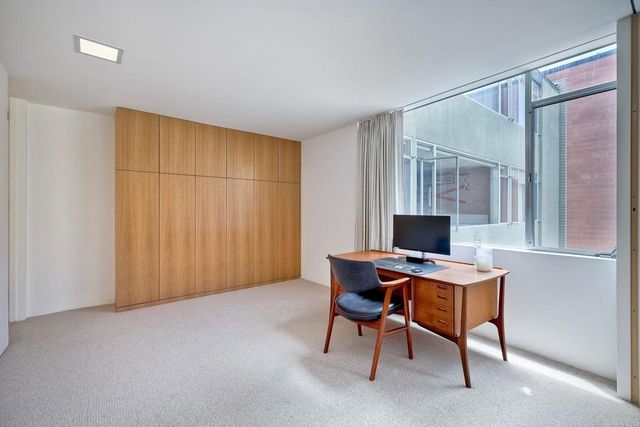 a workspace with furniture and a window