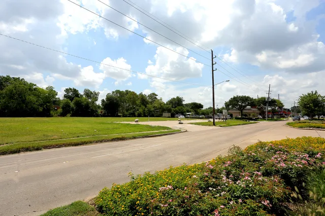 a view of a swimming pool with a yard