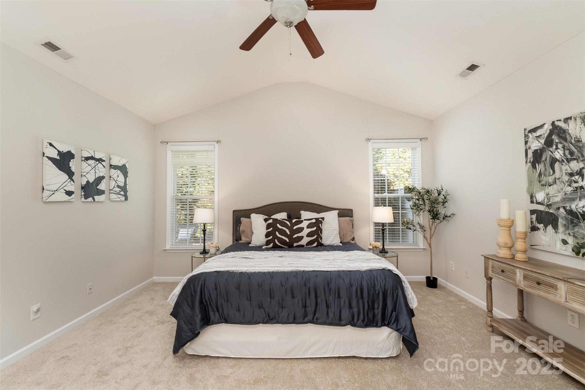 620 Amethyst Circle Fort Mill, SC 29708 - Photo 20 of 32 a bedroom with a large bed and a chandelier