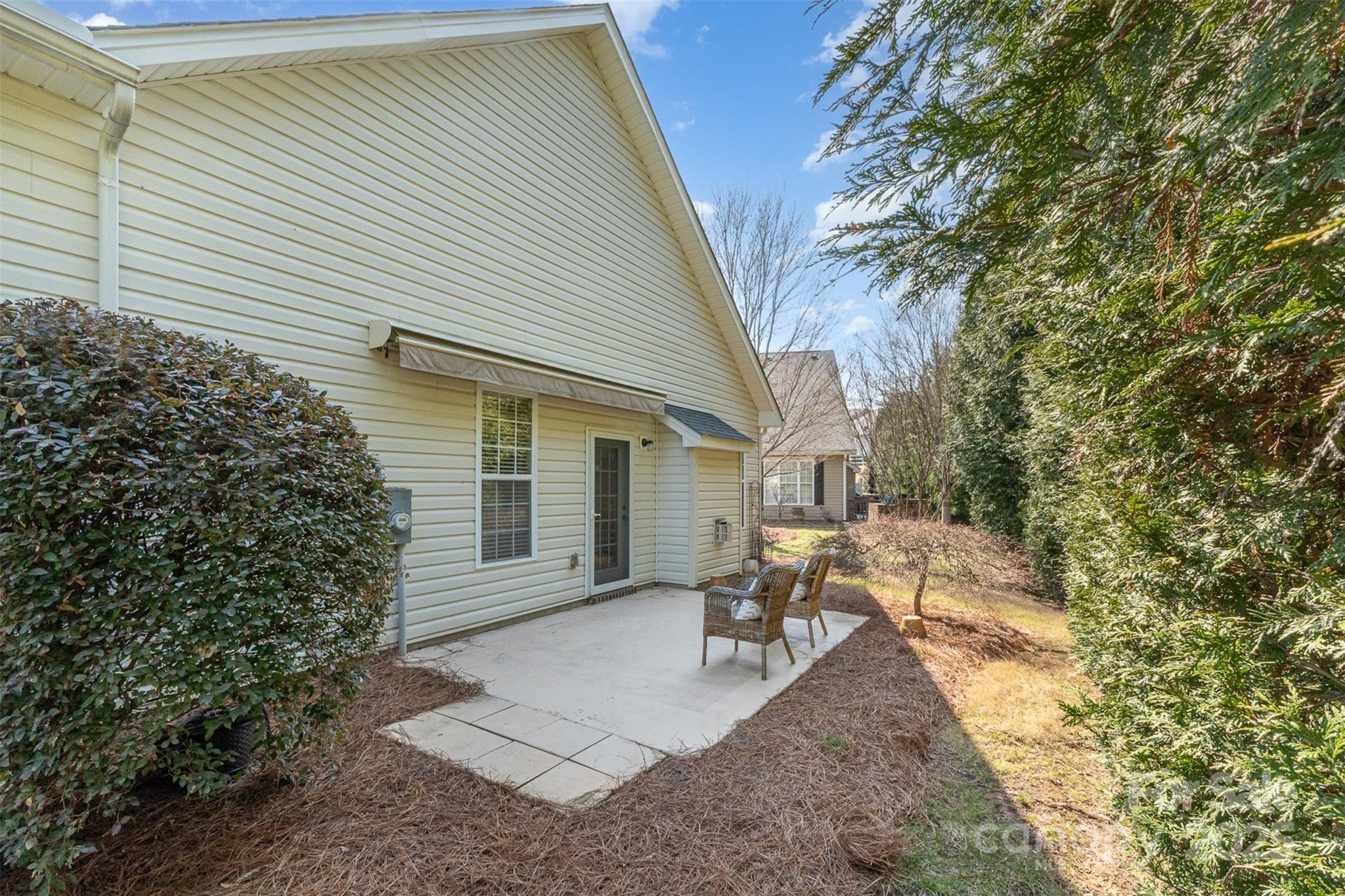 620 Amethyst Circle Fort Mill, SC 29708 - Photo 30 of 32 a view of a patio with table and chairs and potted plants