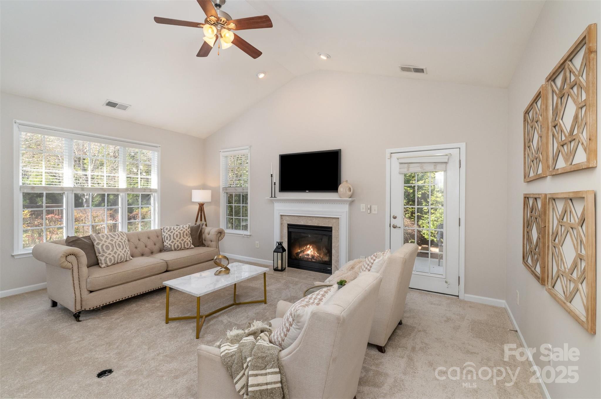 620 Amethyst Circle Fort Mill, SC 29708 - Photo 6 of 32 a living room with furniture a fireplace and a flat screen tv