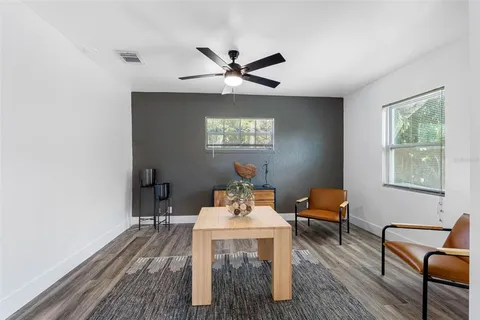 a dining room with furniture and window