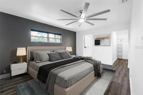 a bedroom with bed and a window