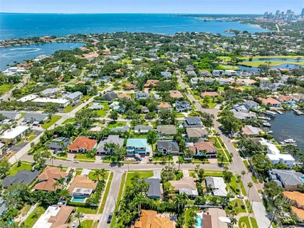 an aerial view of residential houses with outdoor space