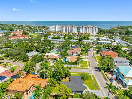an aerial view of a residential apartment building with a yard