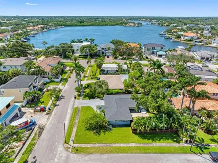 an aerial view of residential house with outdoor space and lake view