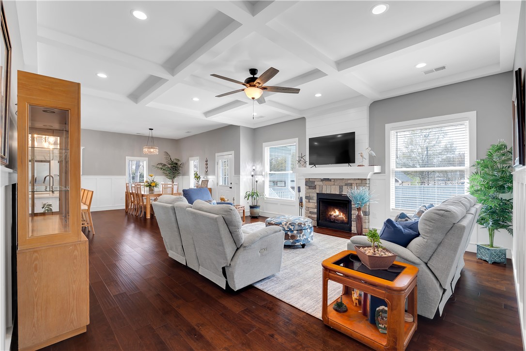 181 Amberwood Drive Anderson, SC 29621 - Photo 5 of 28 This inviting living area boasts rich hardwood floors and a cozy stone fireplace, perfect for gatherings.