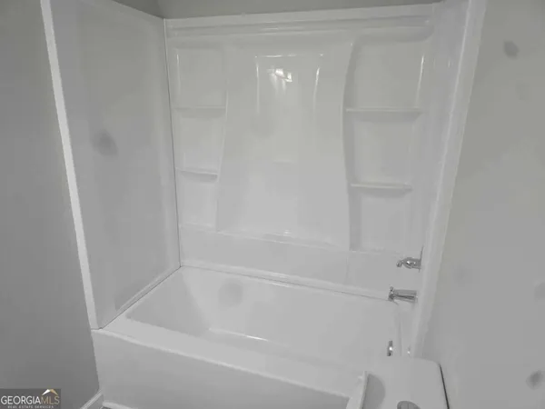 a close up view of a bathtub in a bathroom