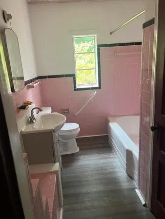 a bathroom with a sink toilet and shower