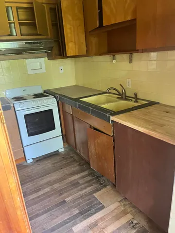 a kitchen with a sink and cabinets