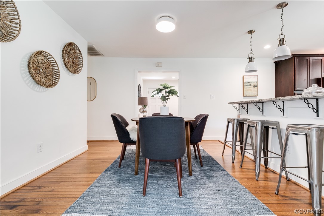 4061 Old Gun Road East Midlothian, VA 23113 - Photo 25 of 42 a view of a dining room with furniture and wooden floor