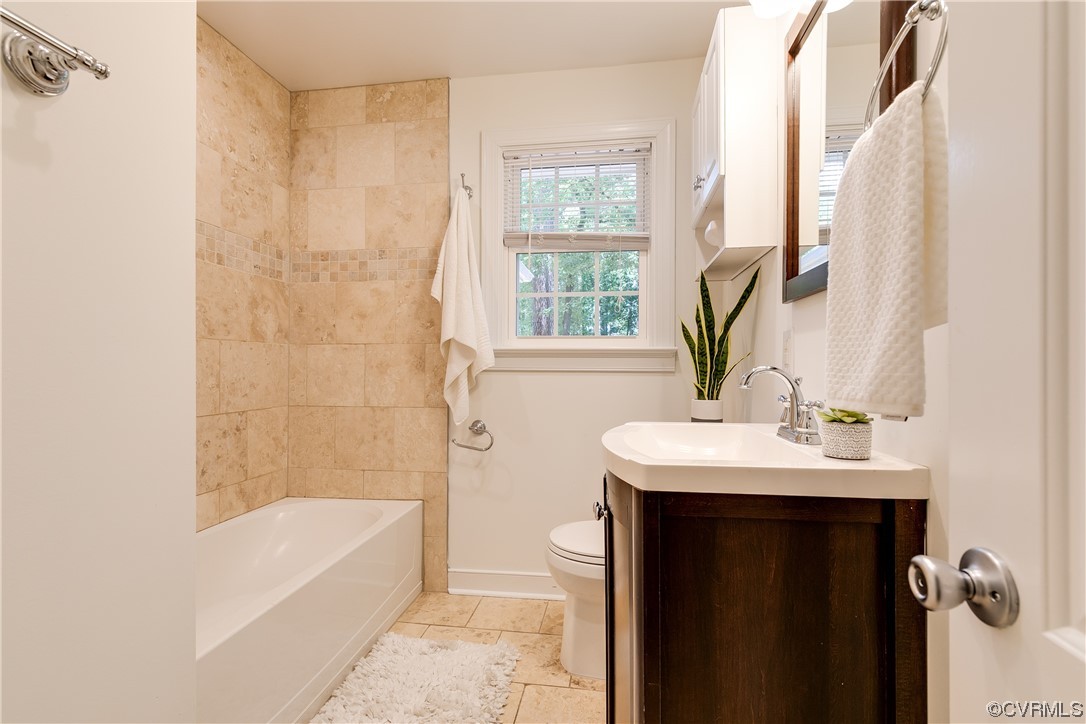 4061 Old Gun Road East Midlothian, VA 23113 - Photo 26 of 42 a bathroom with a sink a bathtub and a shower