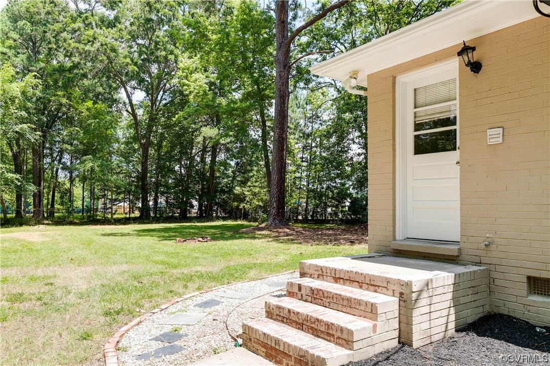 4061 Old Gun Road East Midlothian, VA 23113 - Photo 35 of 42 a view of a backyard with large trees