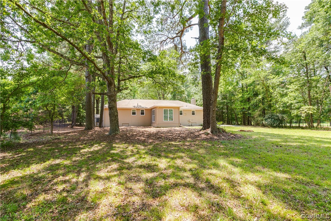 4061 Old Gun Road East Midlothian, VA 23113 - Photo 36 of 42 a big yard with large trees and a small yard