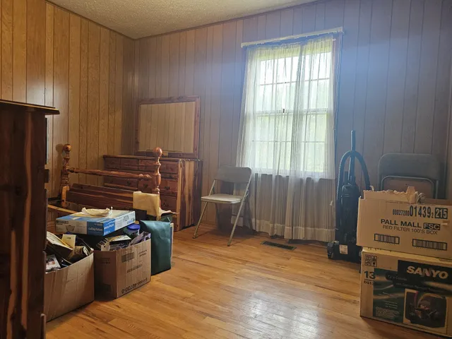 a kitchen with a wooden floor and a stove top oven