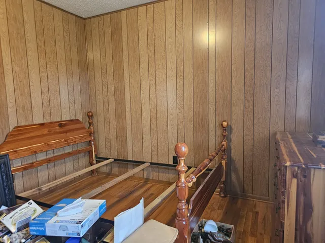 a room with a bed and a chandelier