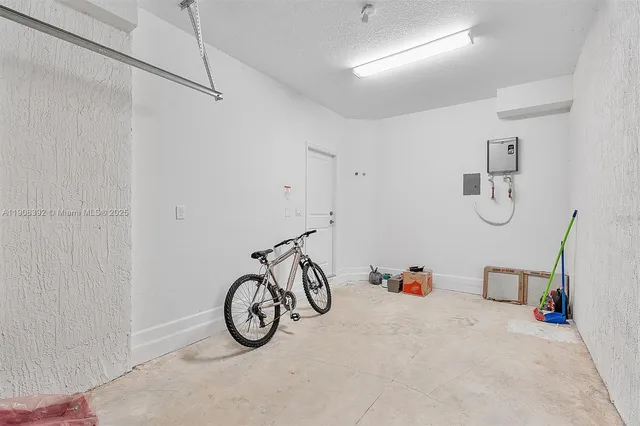 a view of an bike storage and utility area in a room